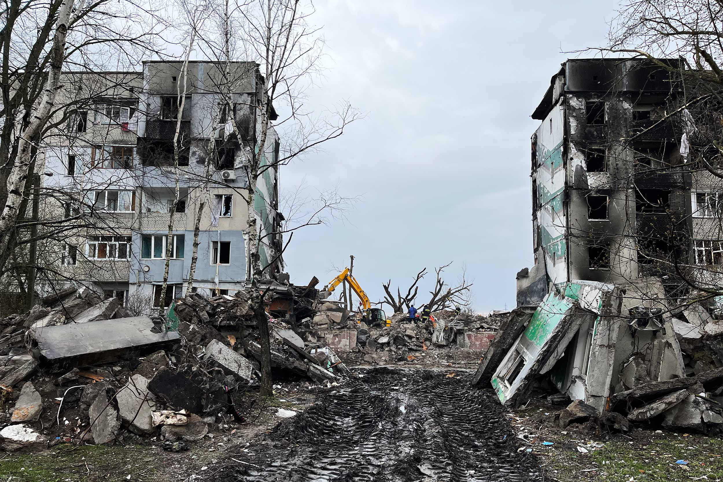 The collapsed building in Borodyanka where the Smishchuk family died, when it was hit by a Russian shell, March 1. Vitaliy, Tetiana and Eva Smishchuk were sheltering in the basement. © IWPR