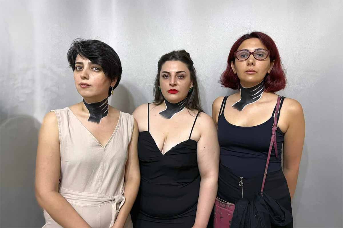 On June 23, feminist activists Narmin Shahmarzade, Gulnara Mehdiyeva and Sanubar Heydarova staged a protest in support of Soyudlu's residents at the US embassy. They painted a black hand on their throats to symbolise the villagers' struggle to breath due to the toxic fumes in the area. The three women were expelled from the embassy's grounds and handed over to the police. Photo courtesy of the activists.