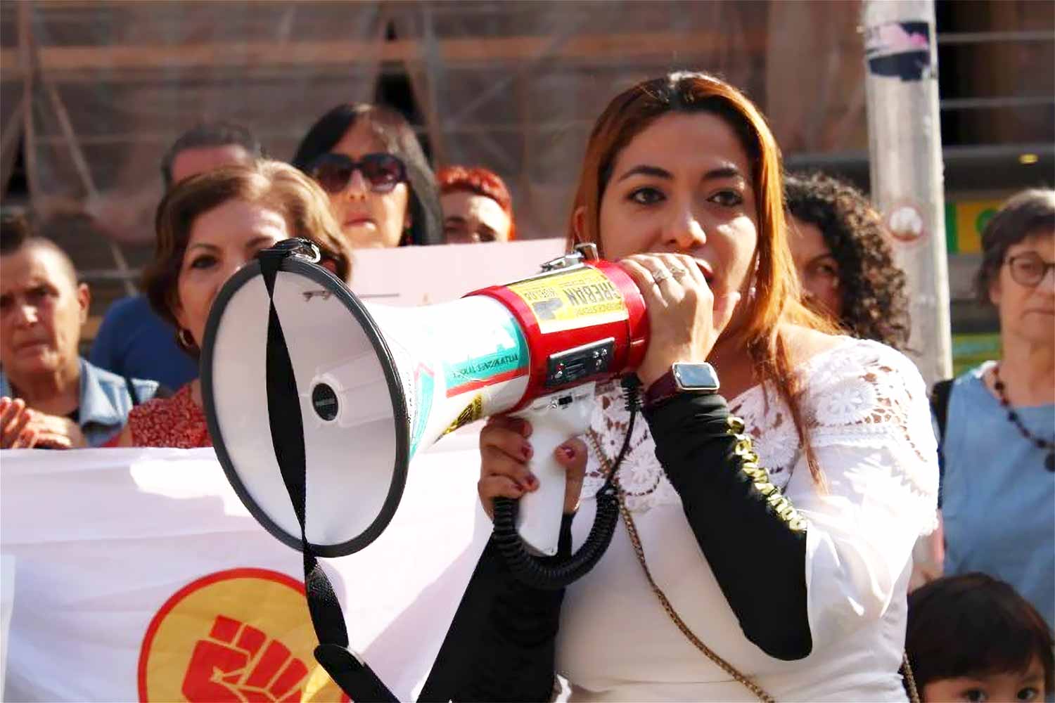 Ivania Cruz, a spokesperson for the Human Rights and Community Defense Unit, left left El Salvador in February 2025 and was unable to return due to an arrest warrant against her. © UNIDEHC