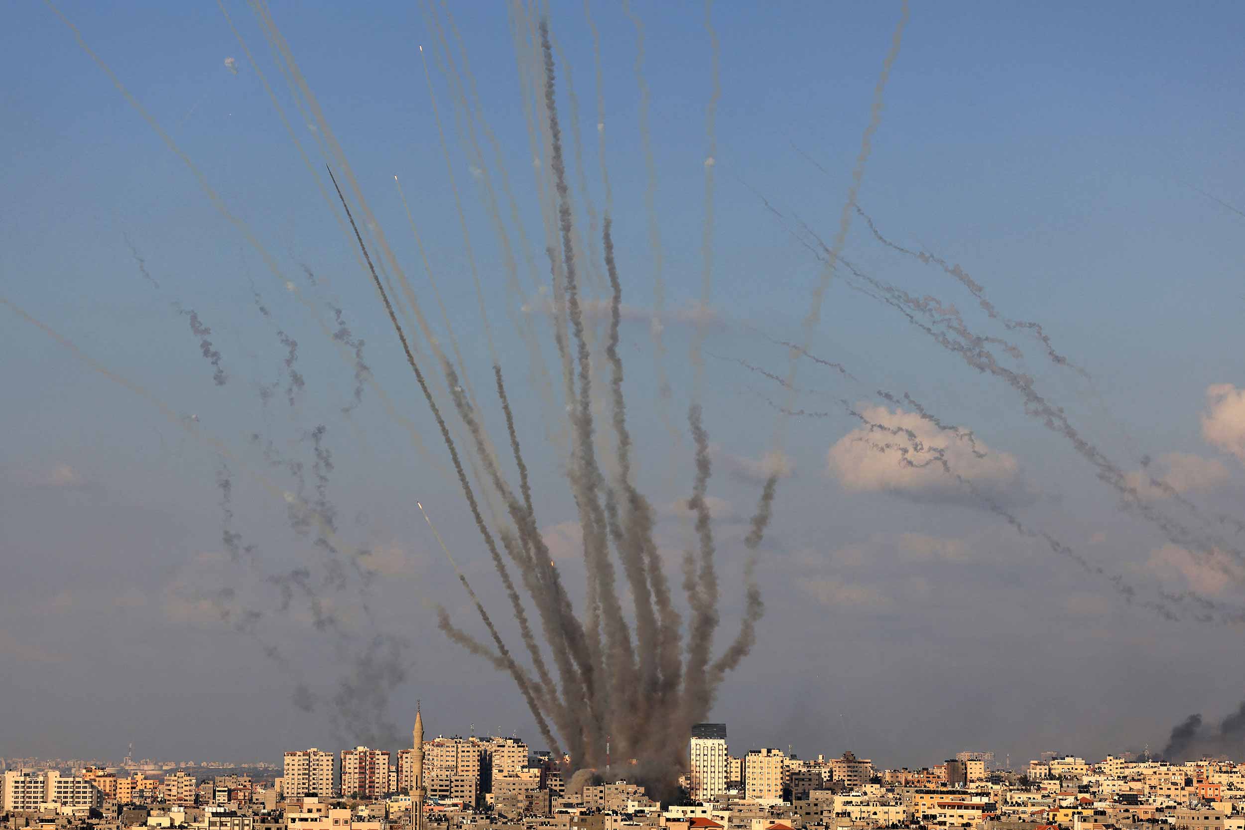 A salvo of rockets is fired by Palestinian militants from Gaza towards Israel on October 10, 2023. Israel said it recaptured Gaza border areas from Hamas as the war's death toll passed 3,000 on October 10, the fourth day of gruelling fighting since the Islamists launched a surprise attack. © Mahmud Hams/AFP via Getty Images