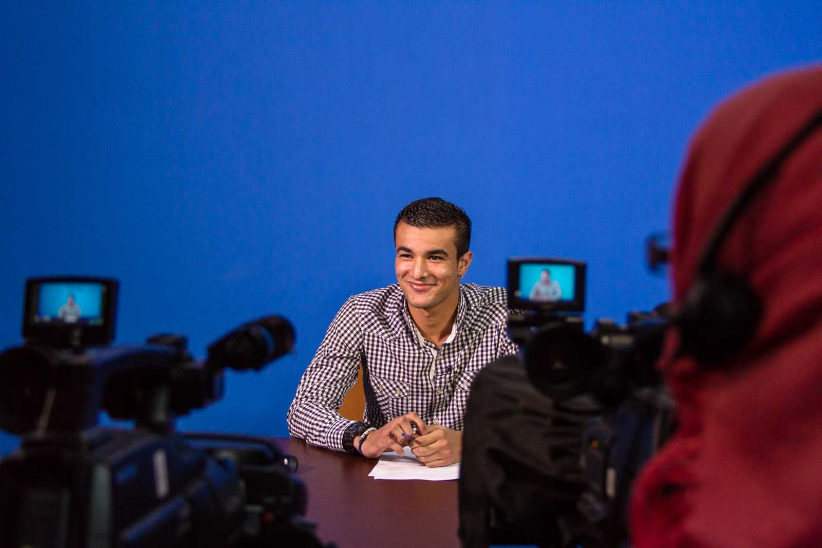 IWPR trainees producing a TV news segment as part of course at The University of Tripoli Media Lab, March 2014. © IWPR