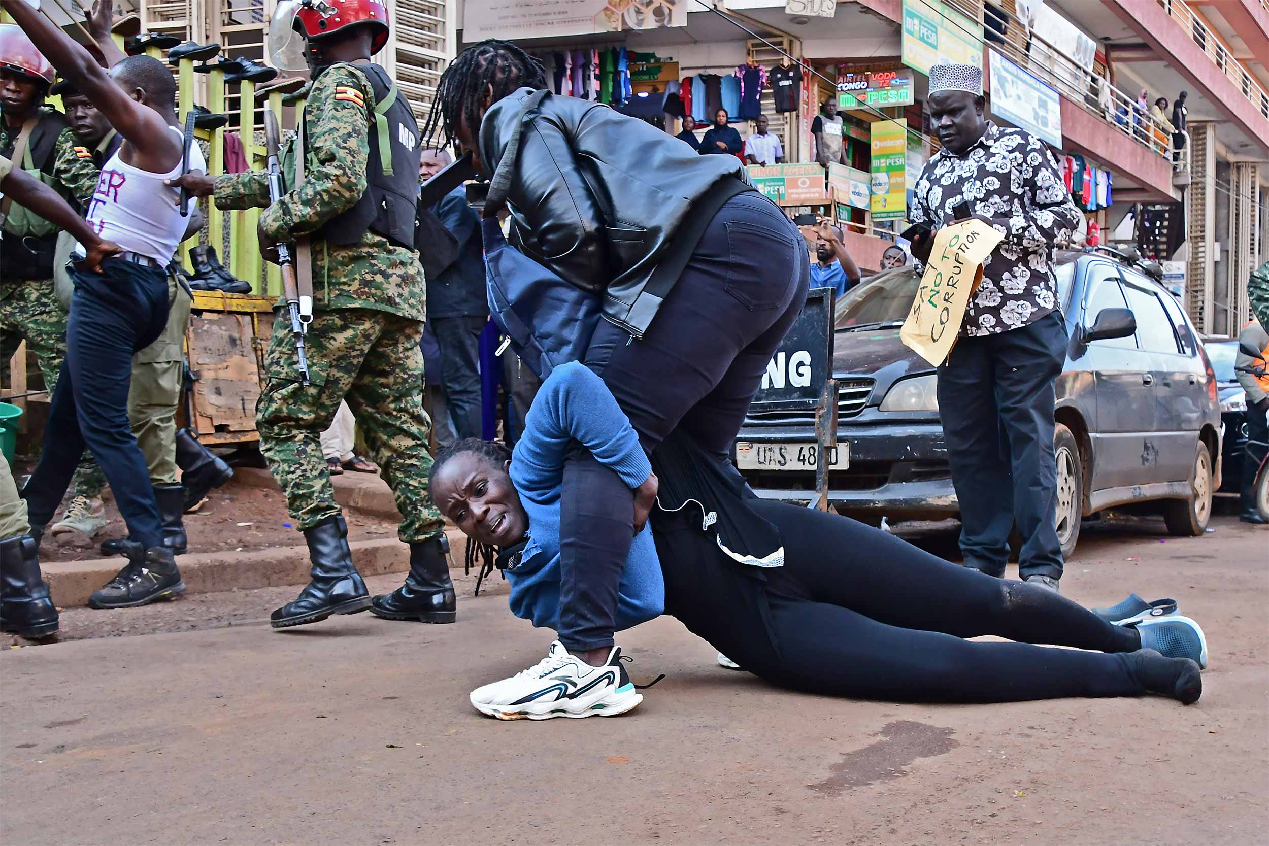 A plain clothed security arrests a female protestor in Kampala on July 23 2024. That day plain clothed operatives, military officers, and policemen arrested over 100 youths to suppress the March2Parliament protests. © Haggai Matsiko/IWPR/Agora