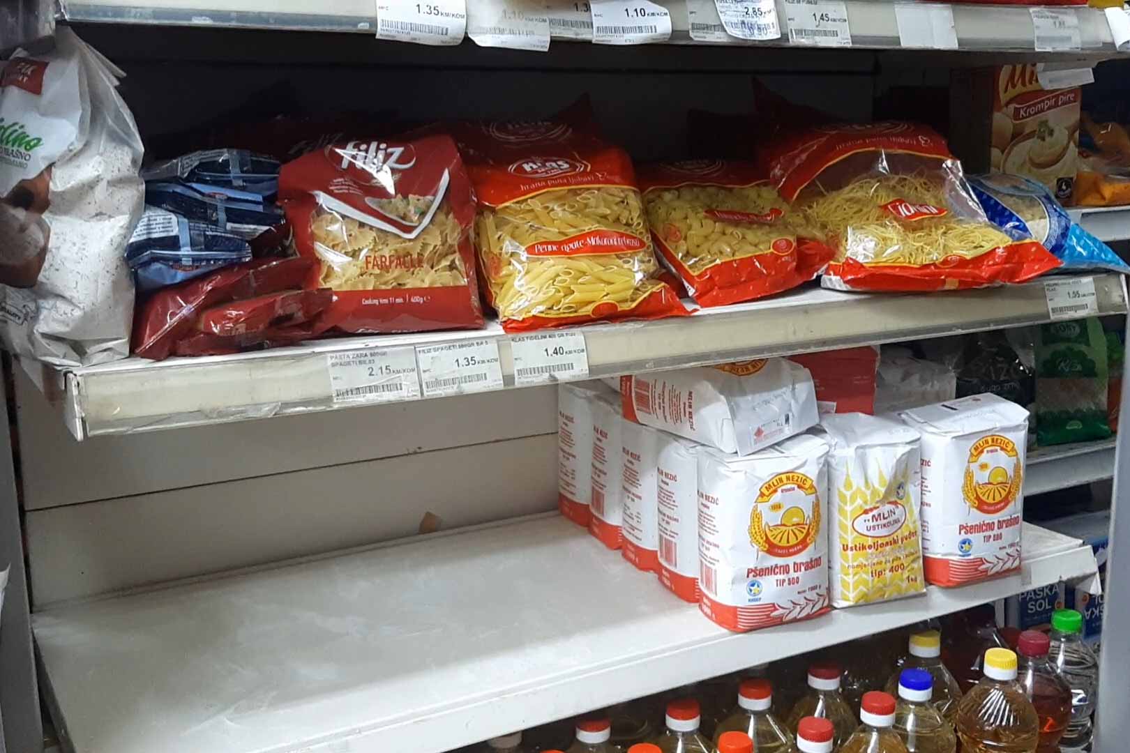 Half-empty shelves in a Sarajevo grocery store with flour in high demand. © Marija Arnautović