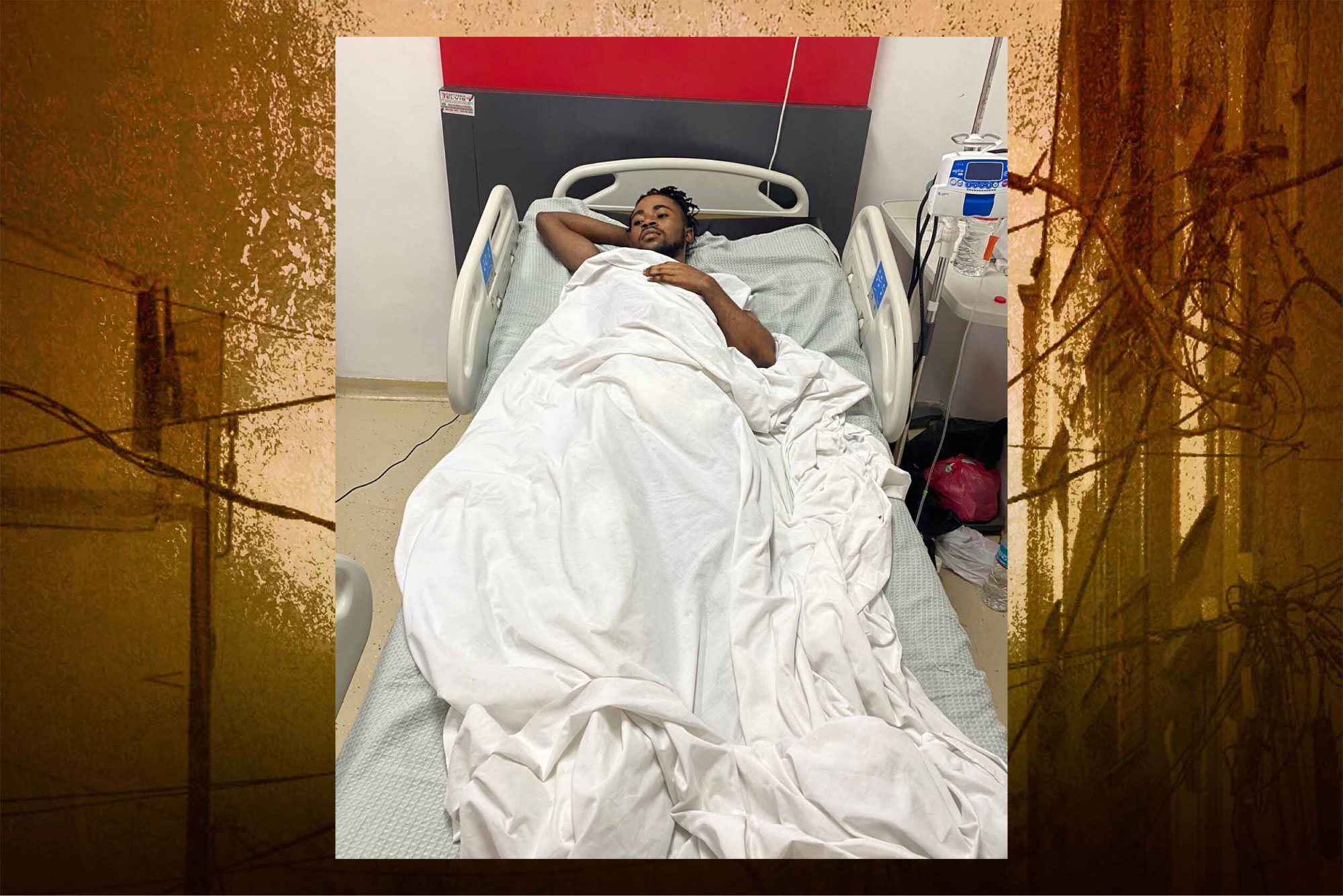 Keken, a 22-year-old Haitian man, is in a hospital in the Dominican Republic. His body is bandaged after falling off a roof while being chased by a police officer.