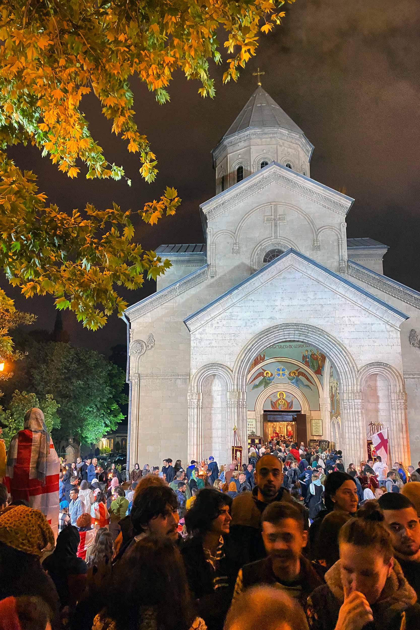 Easter vigil in the yard of Kashveti Church on Rustaveli Avenue, where young protesters joined parishioners in a symbolic act of reconciliation and mutual understanding. © Beka Bajelidze