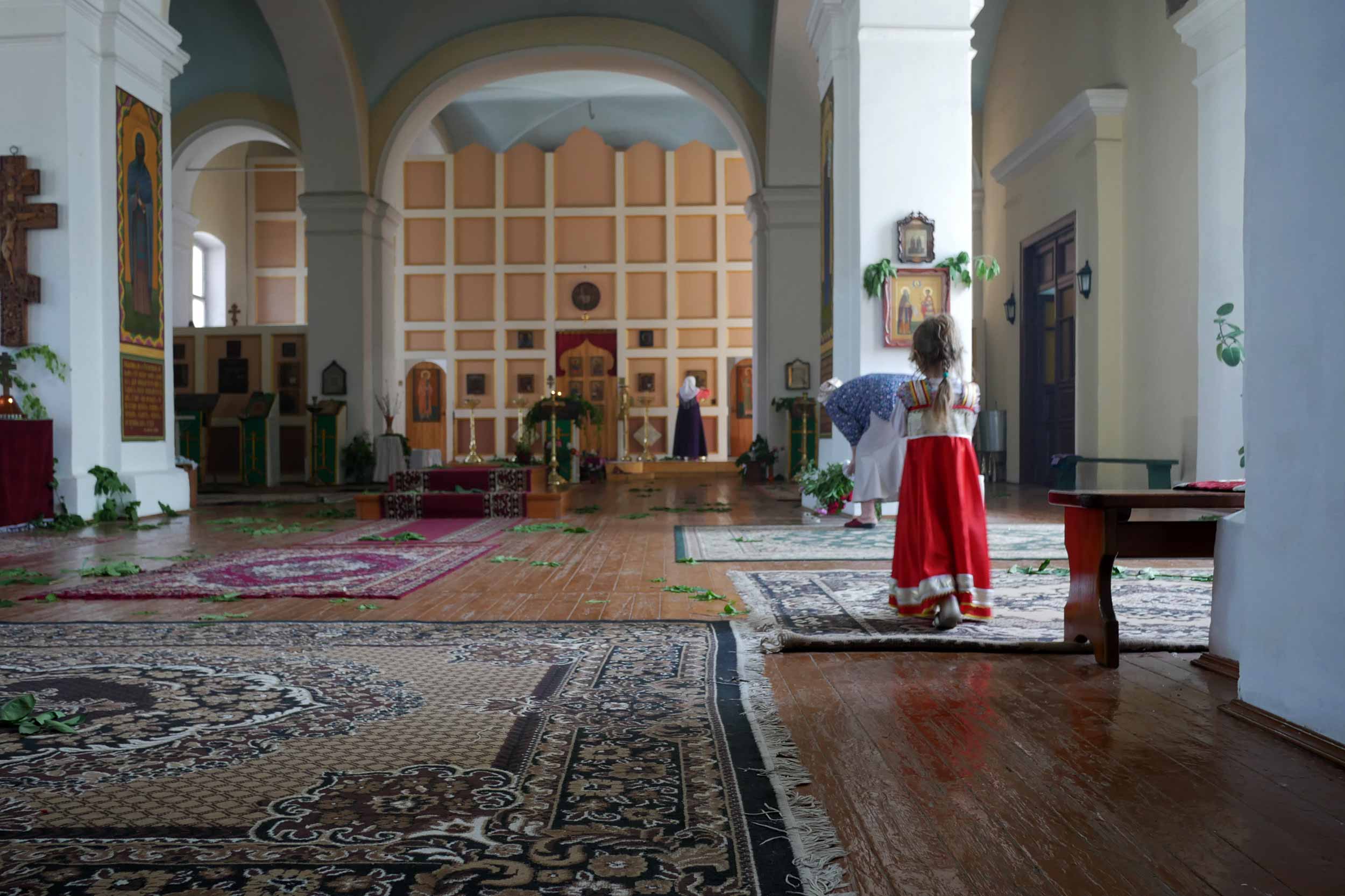 A little girl stands in the Old Believers’ church in Uralsk, in north-western Kazakstan. The community numbers about 50 people and is led by Father Konstantin, the country’s only Old Believers’ priest. © Talgat Umarov