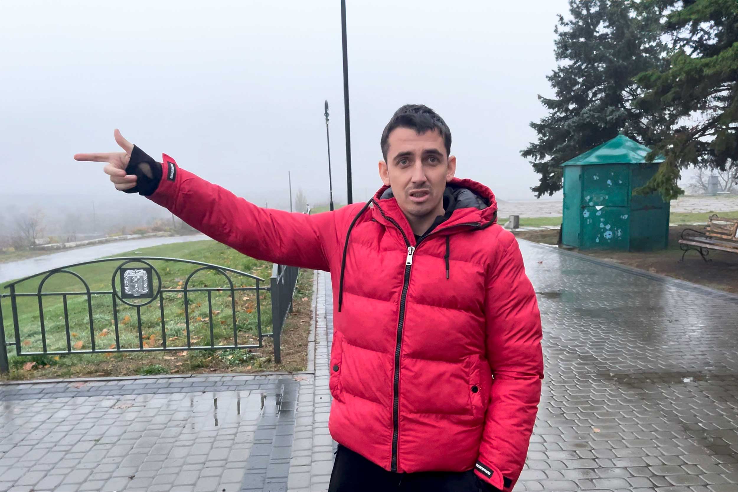 From the town centre, Denys Tsyba, a local humanitarian worker, shows the conflict line during occupation. Locals fear the Russians may return there, and the area is being evacuated. © IWPR