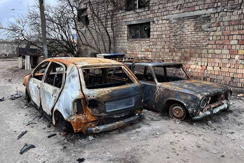 Burnt civilian cars in Hostomel, about 30 kilometres from Kyiv. During the battle for control of the strategically important town, the Russian military refused to organise so-called green corridors to allow people to leave the captured towns in Kyiv region. © National Police of Ukraine