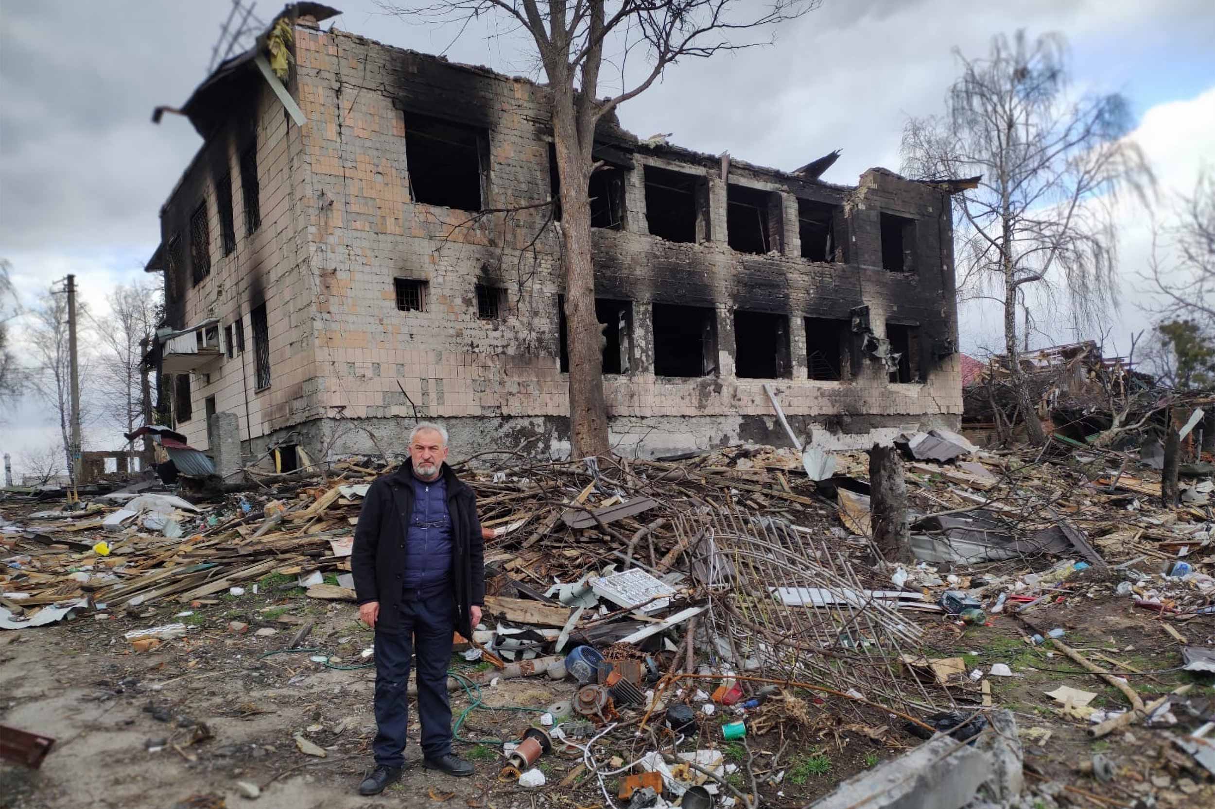 Judge Hennadiy Stasenko in front of the destroyed court building in Borodyanka. Photo courtesy of H. Stasenko.