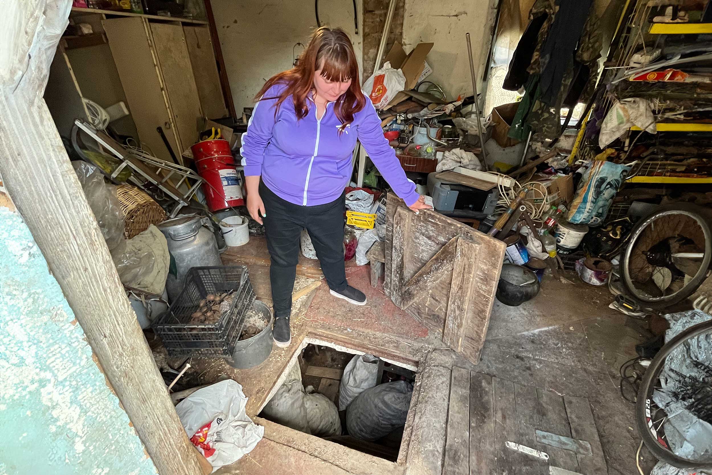 Svitlana Voyteshenko showed the cellar where the 41-year-old used to hide with her daughter, her partner and her brother during the shelling in Chernihiv in March 2022. © Irina Domashchenko