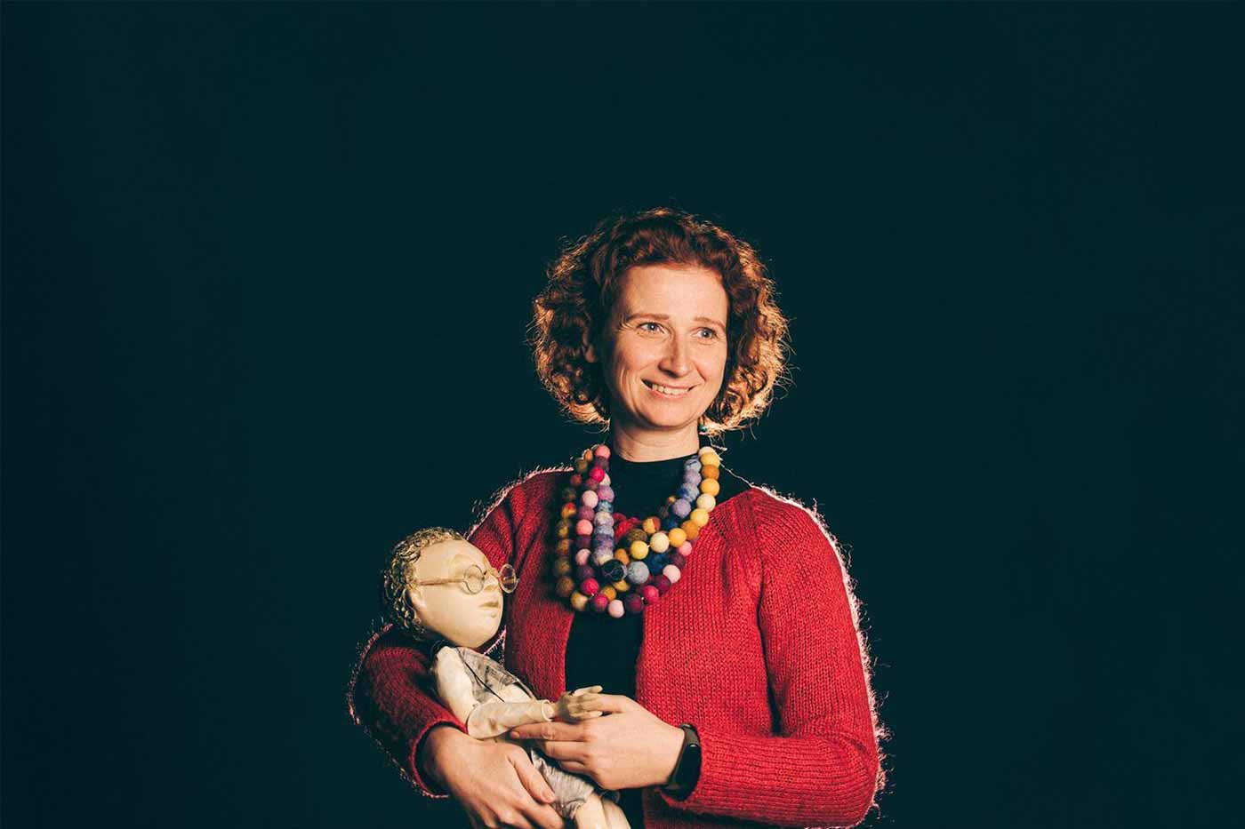 Ulyana Moroz, Lviv Puppet Theatre director on the stage with one of the puppets. © Lviv Puppet Theatre